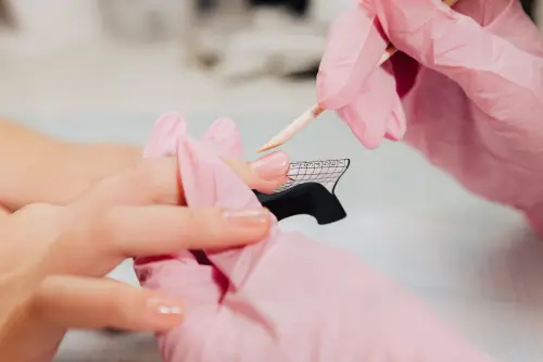 manicure-process-master-forms-artificial-nail-from-special-gel-using-bamboo-stick